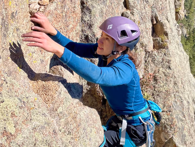 Woman rock climbing Boulder Canyon