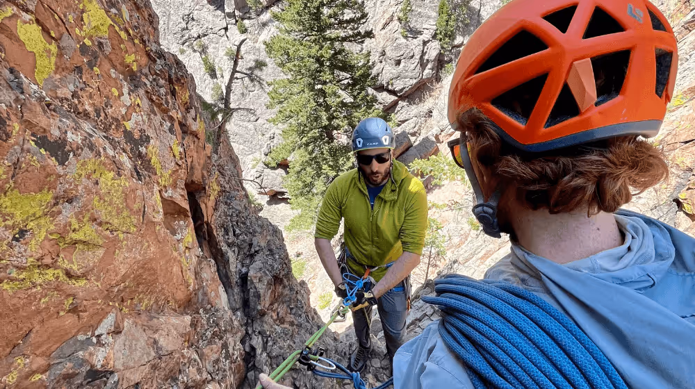 Photo of Max Lurie providing rock climbing instruction in Boulder, CO