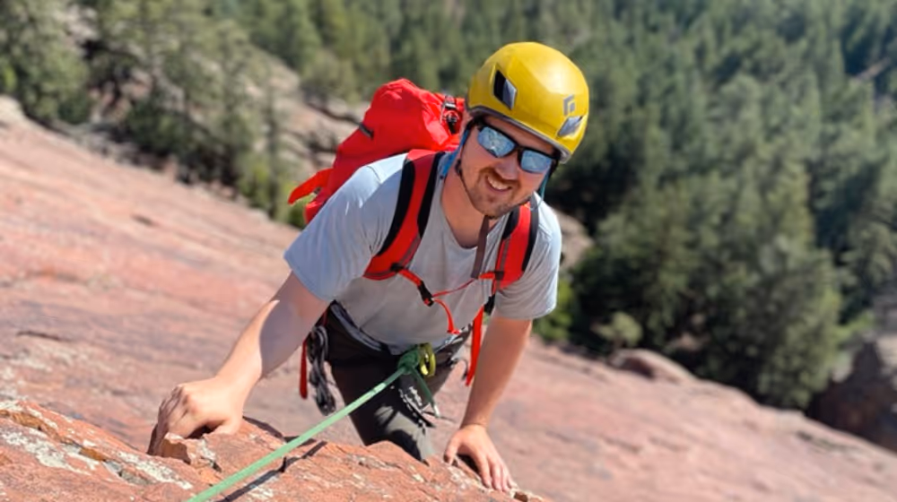 Photo of a man rock climbing in Boulder County, Colorado