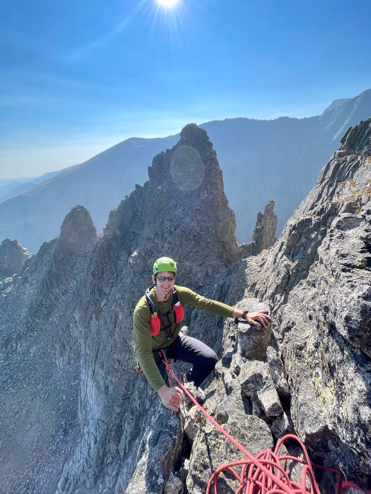 Photo of man at the top of Rock Mountain National Park. 