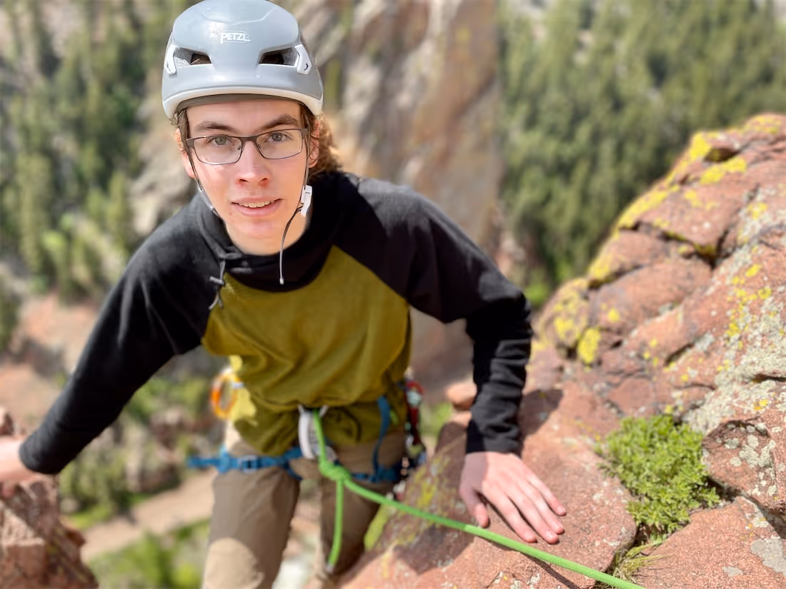 Young man rock climbing in Eldorado Canyon