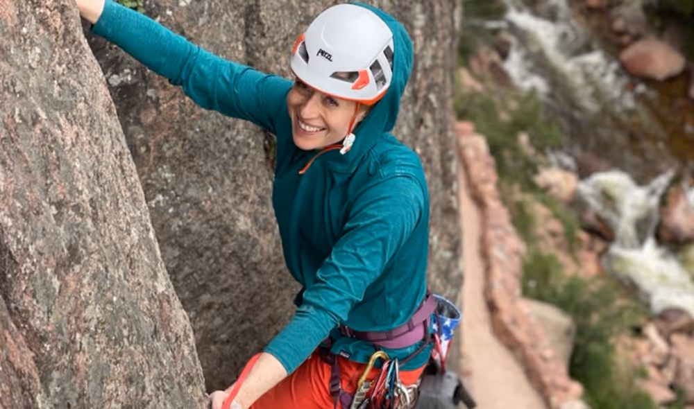Woman rock climbing with Alpine to the Max in Colorado