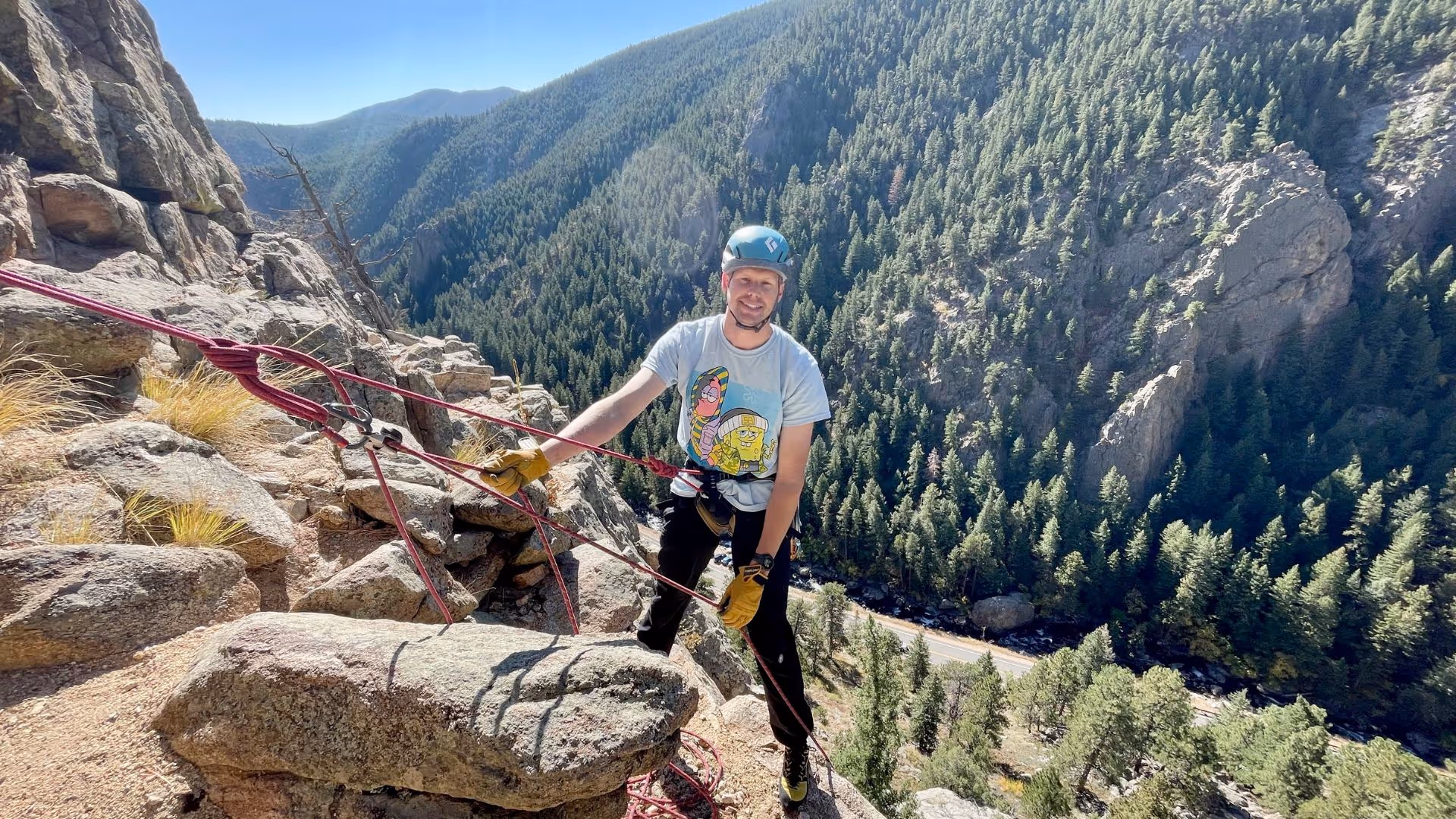Man learning to lead climb in Boulder, CO with Alpine to the Max