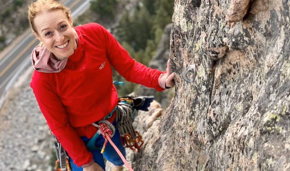 Woman lead climbing with Alpine to the Max