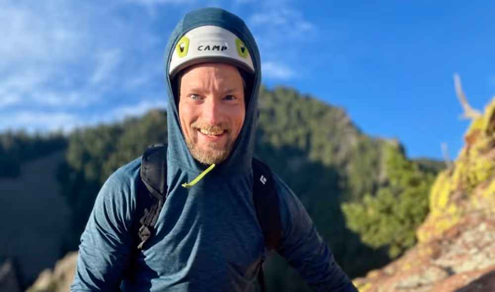 Man completing rock climb in Boulder