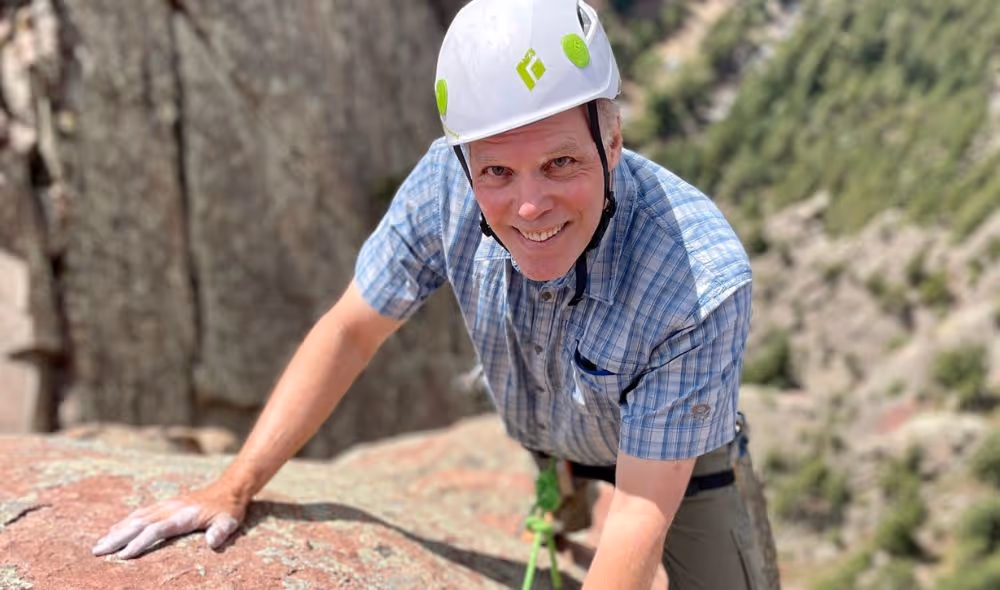 Older man enjoying rock climb in Colorado