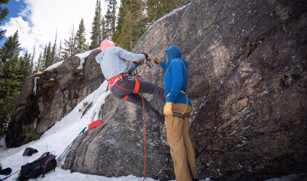 Alpine to the Max teaching a beginner rock climber