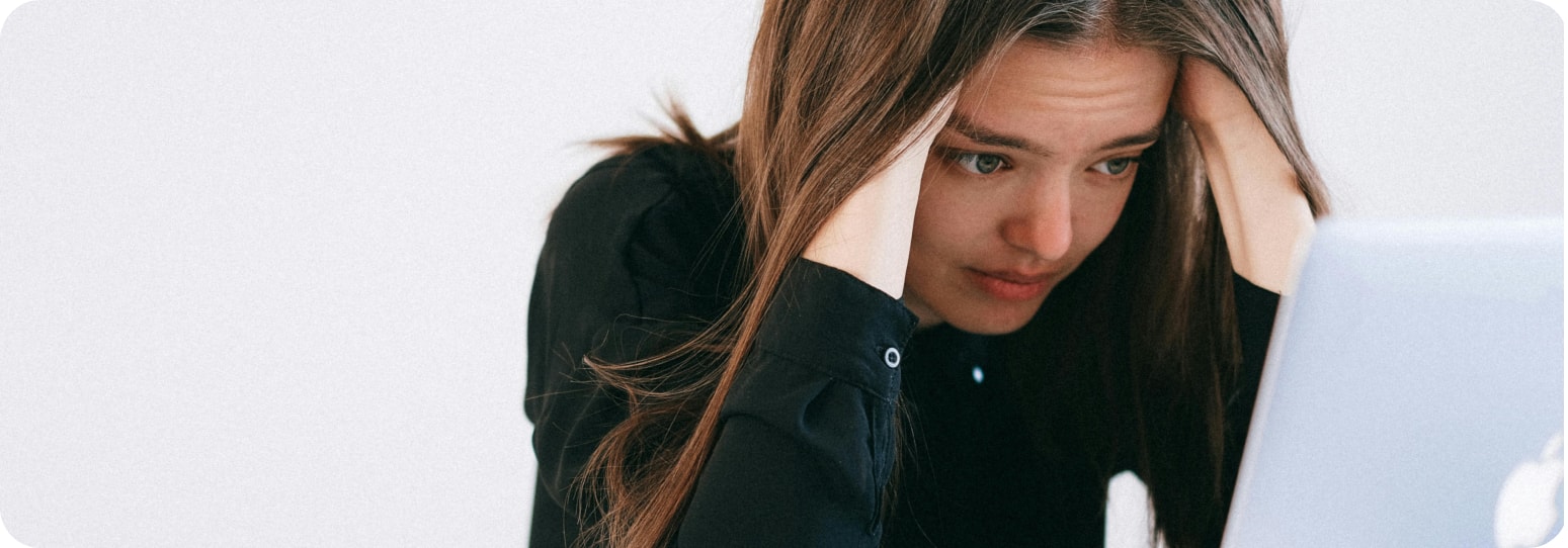 Stressed girl looking at her laptop