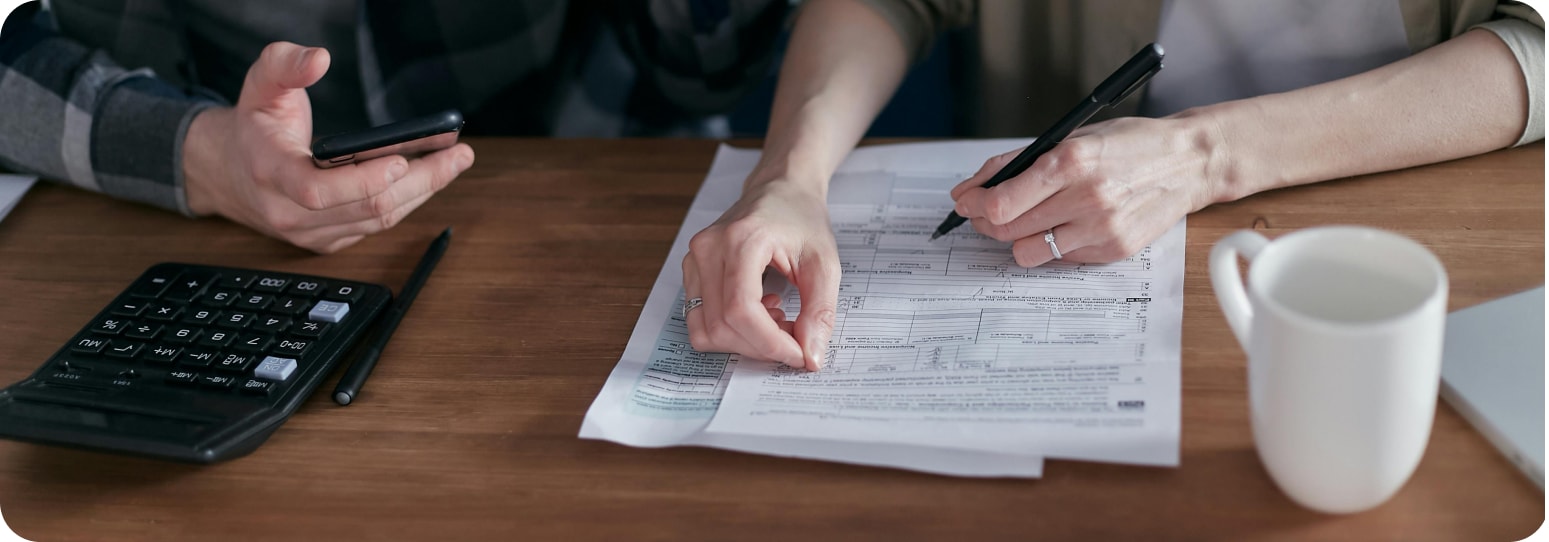 Someone signing a document