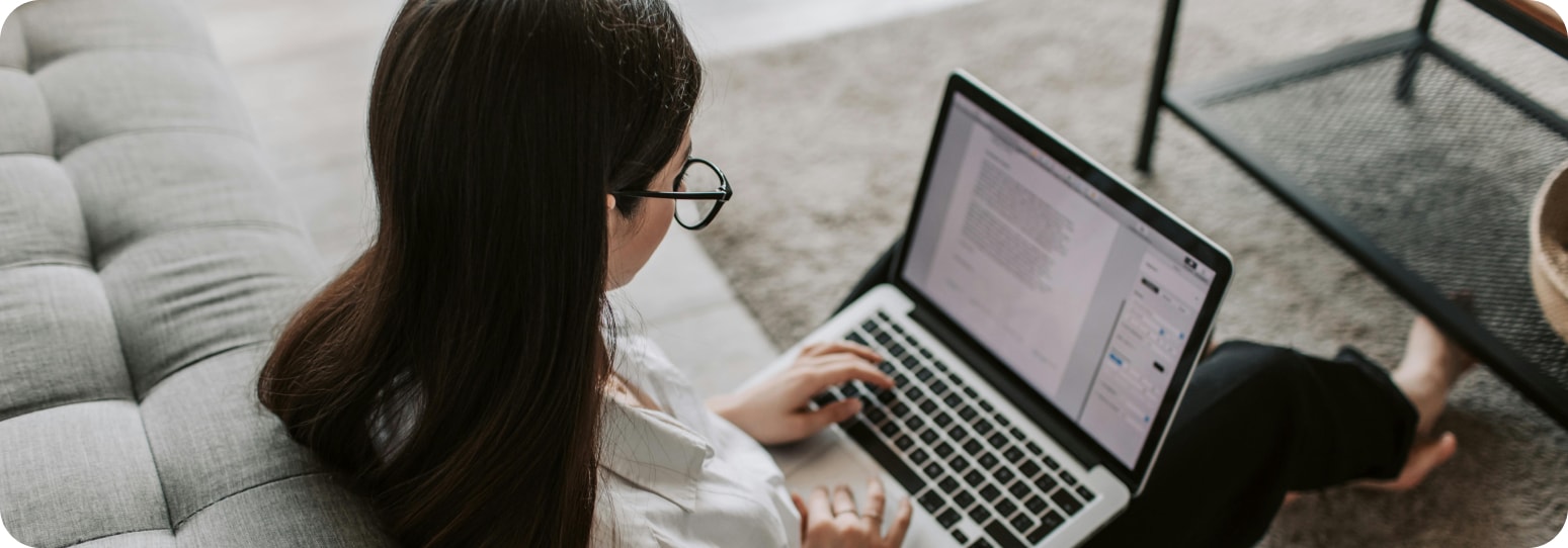Woman applying to something on her laptop