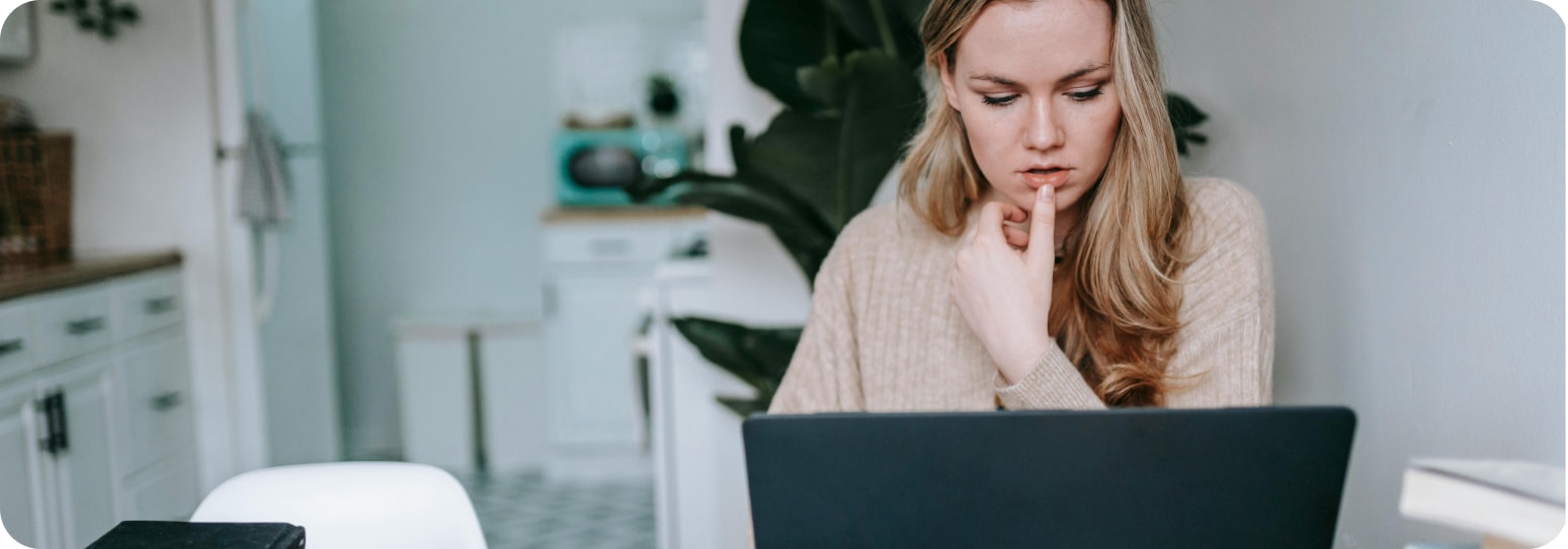 Young woman looking at her computer