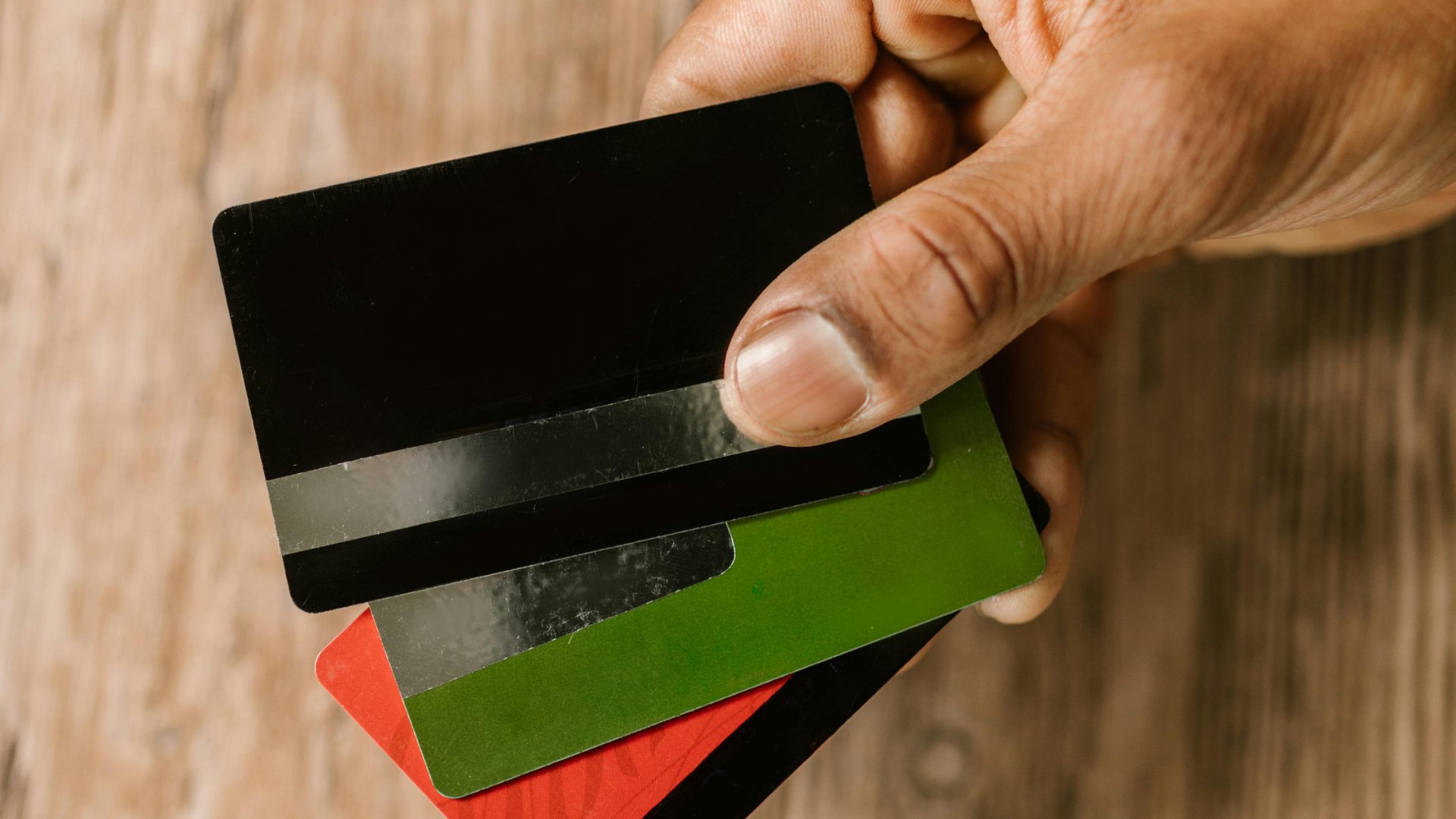 Three different colored credit cards