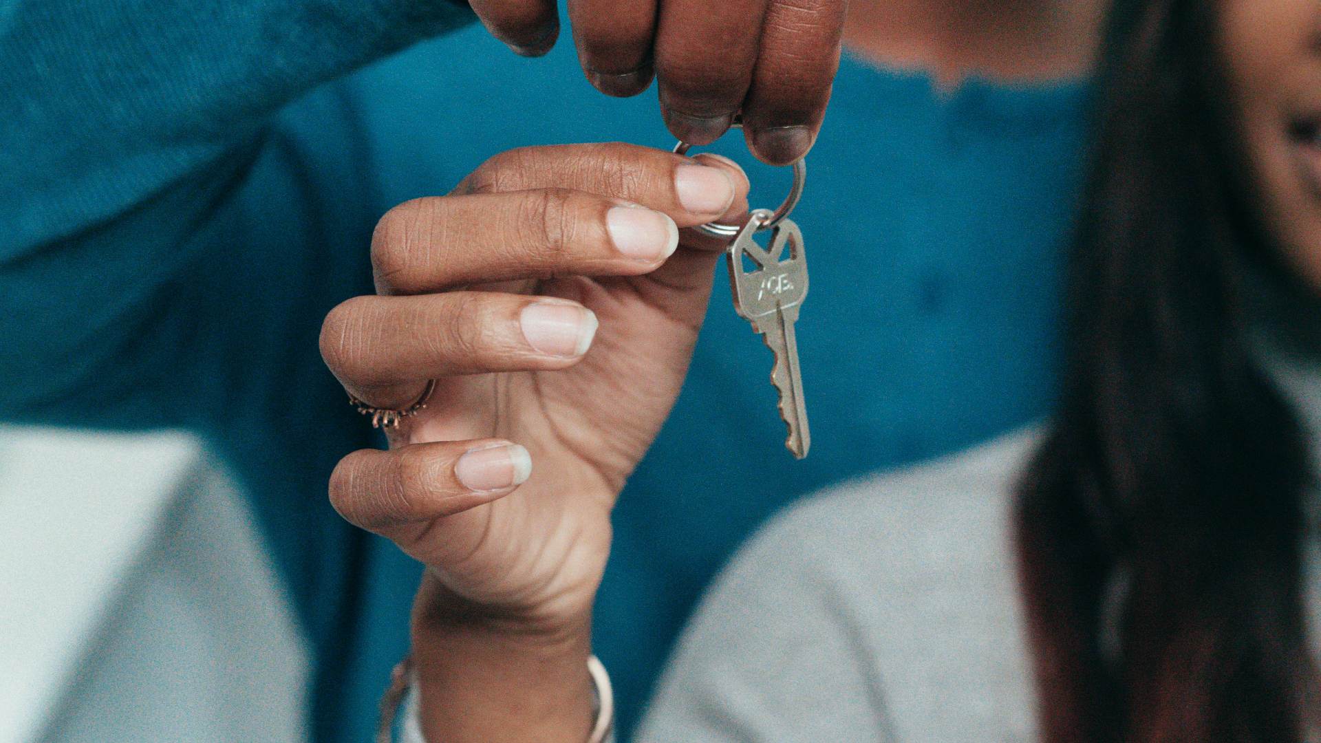 A couple holding a key