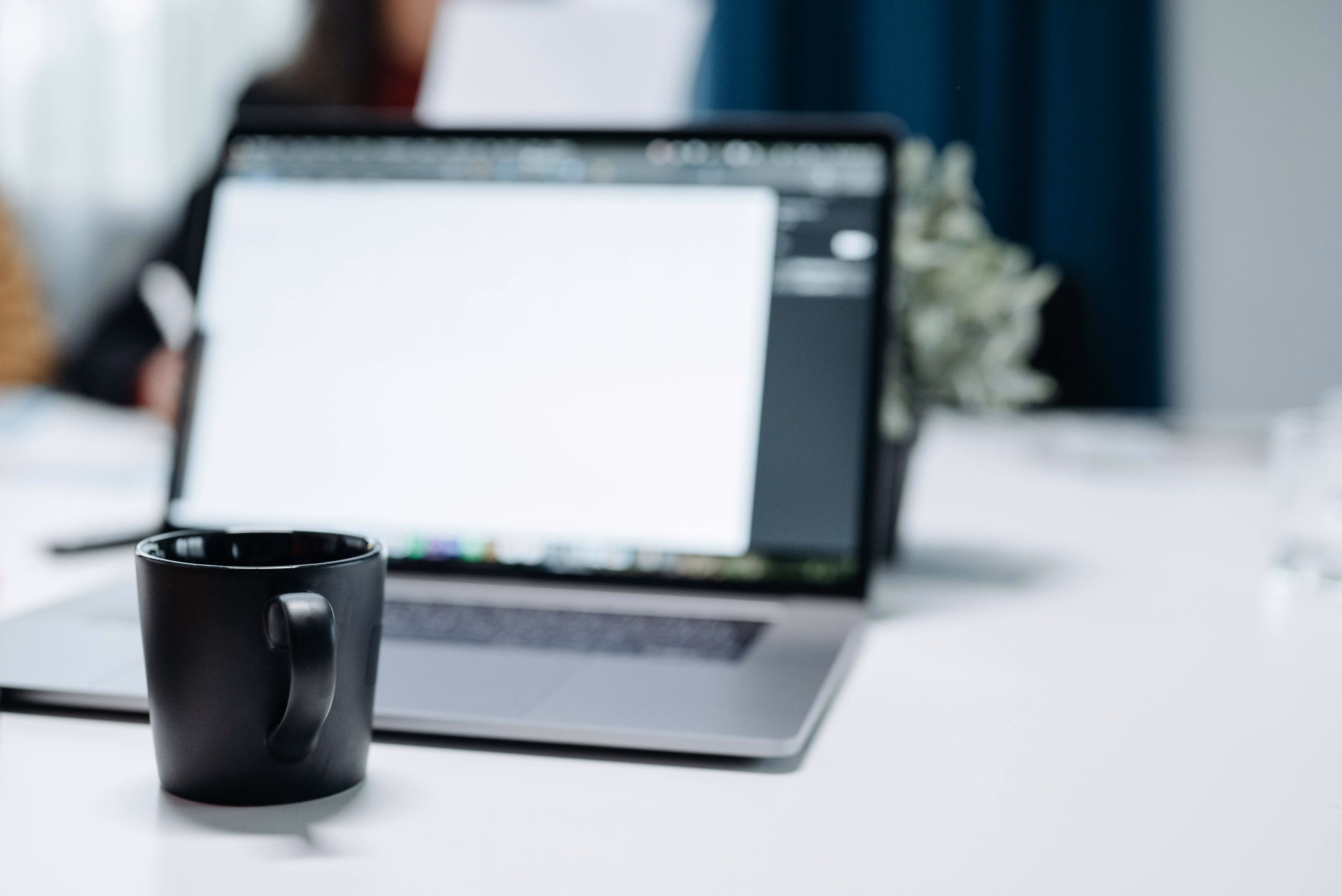 aptop and coffee mug on a desk, representing online account management and digital security.