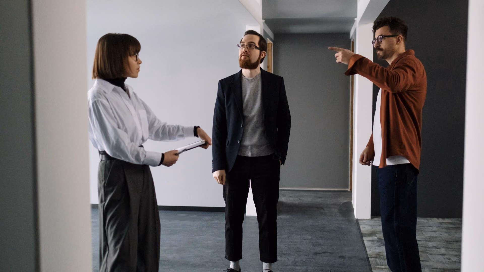 Leasing consultant showing prospective residents an apartment during a property tour. Other options: