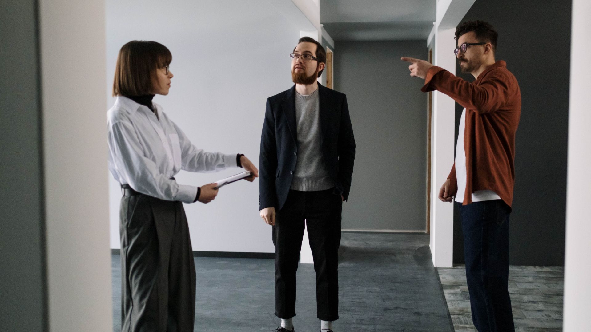 Leasing consultant showing prospective residents an apartment during a property tour.  Other options: