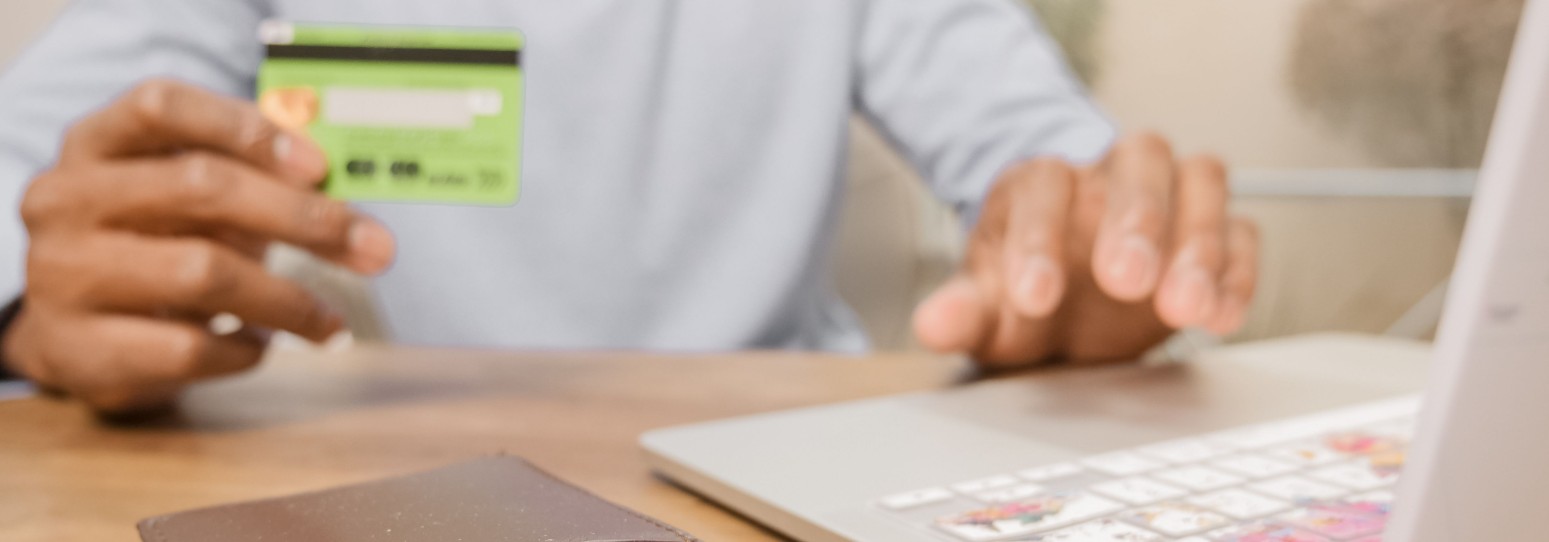 a person holding a credit card