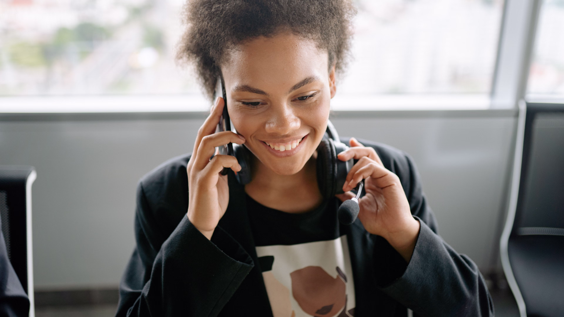 A leasing agent sitting at a desk on the phone