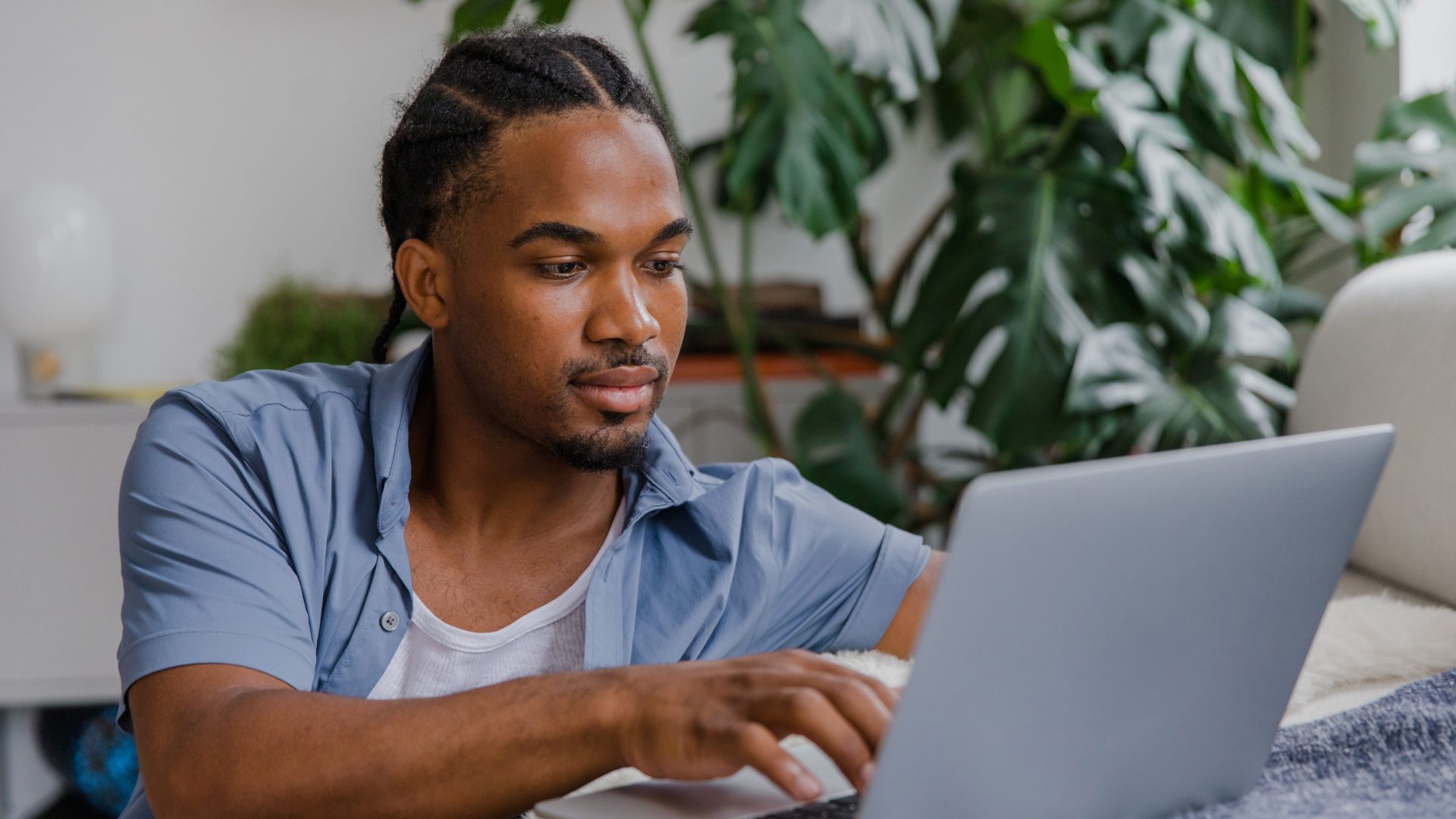 Person using a laptop at home.