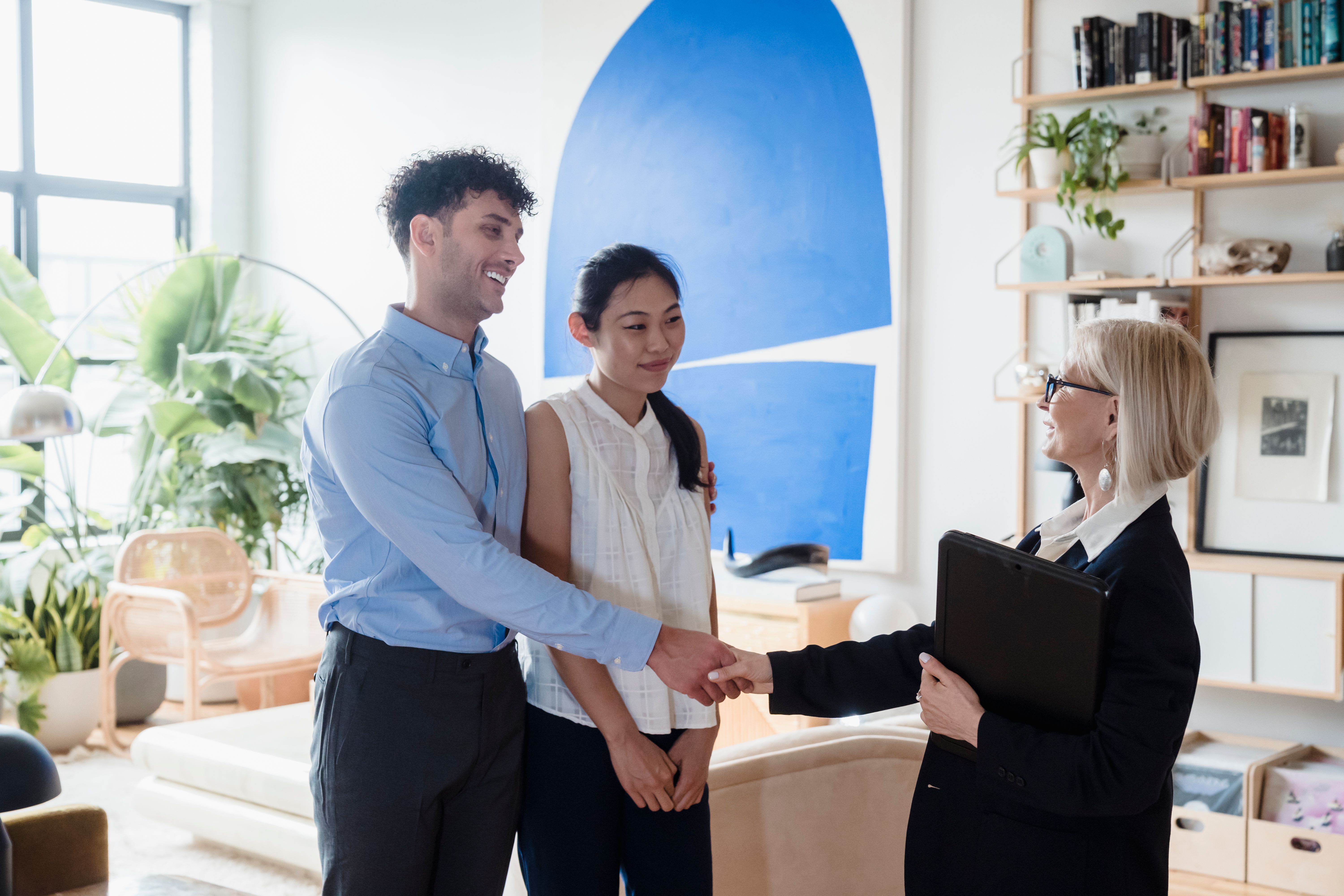Leasing professional greeting prospective residents in an apartment home