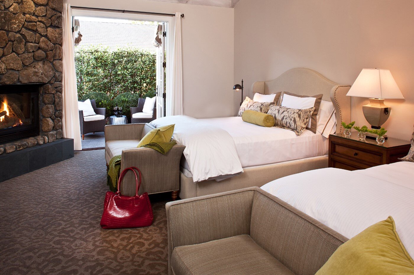 Hotel Yountville guest room with fireplace and private patio
