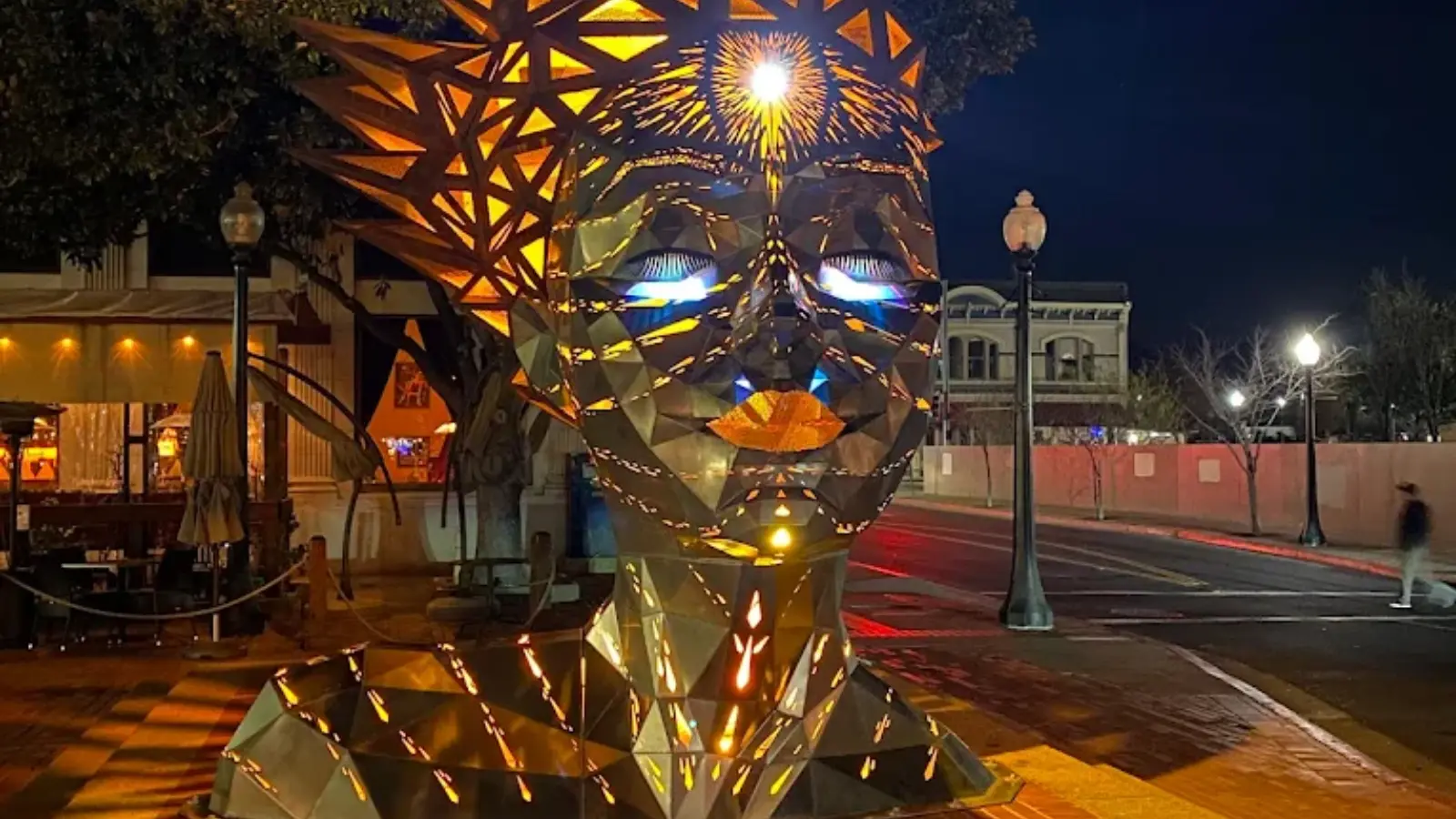 Downtown Napa Art Walk features this illuminated geometric metal sculpture with reflective surfaces creating dramatic light patterns against the evening streetscape