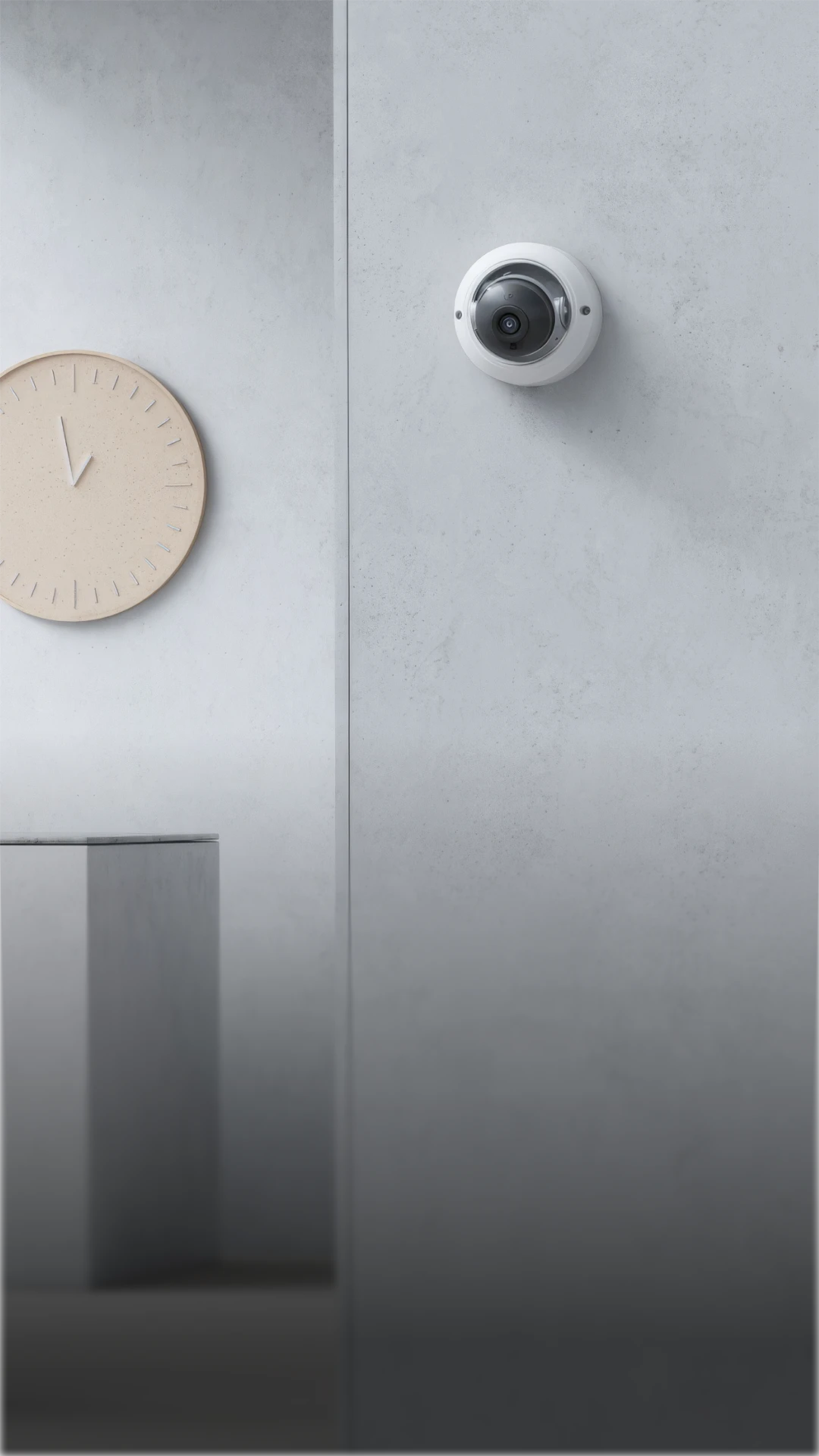 White dome security camera mounted on a light gray concrete wall and a beige wall clock showing 11:55 on the left.