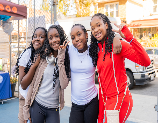 Group of friends waving at camera