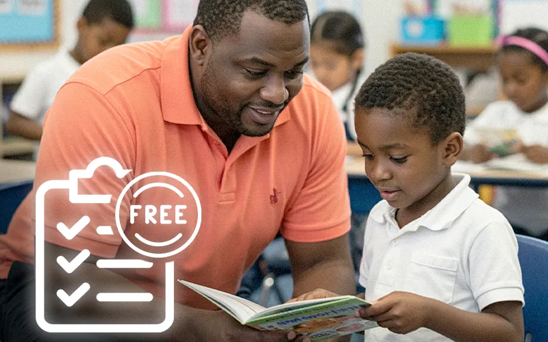 Teacher using a phone as a visual during a structured literacy lesson with elementary students at their desks.