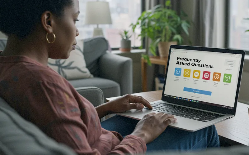 Parent reviews NYC school admissions FAQs on a laptop to plan enrollment decisions.