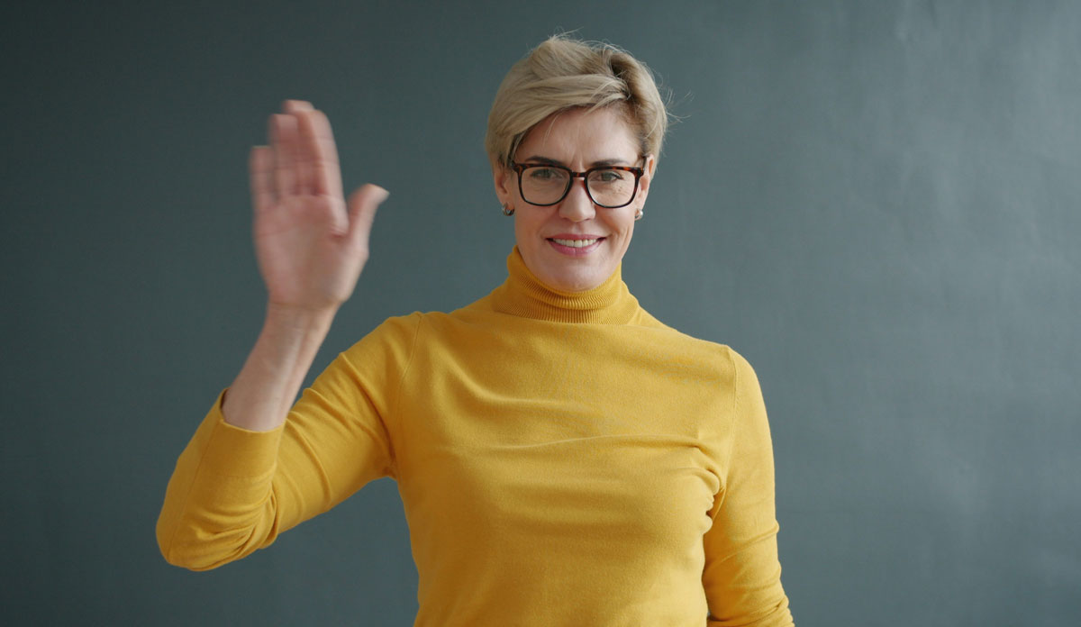 weaving person wearing yellow sweater