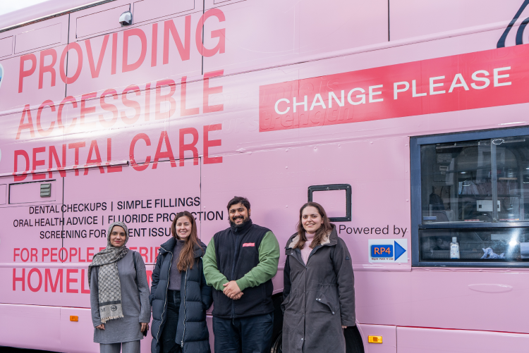 Members of the Kiroku and Change Please team with the Smile For Change bus