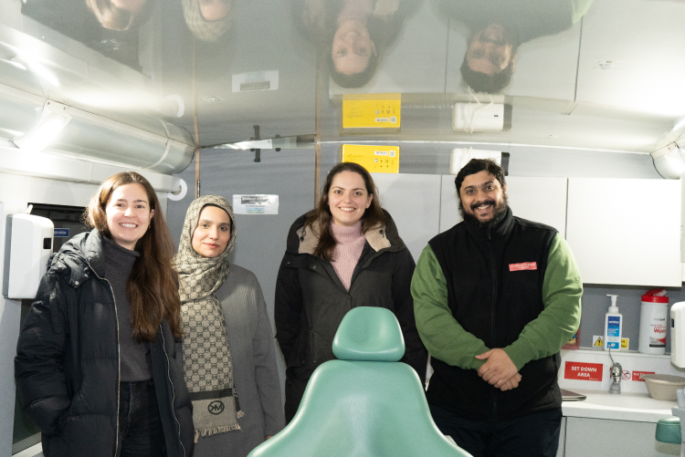 Change Please and Kiroku team members inside the Smile for Change bus