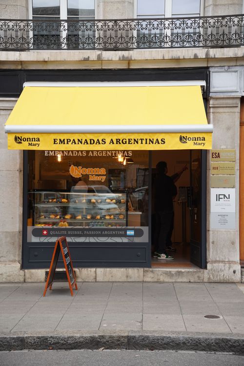 Thin pizza coming out from the oven