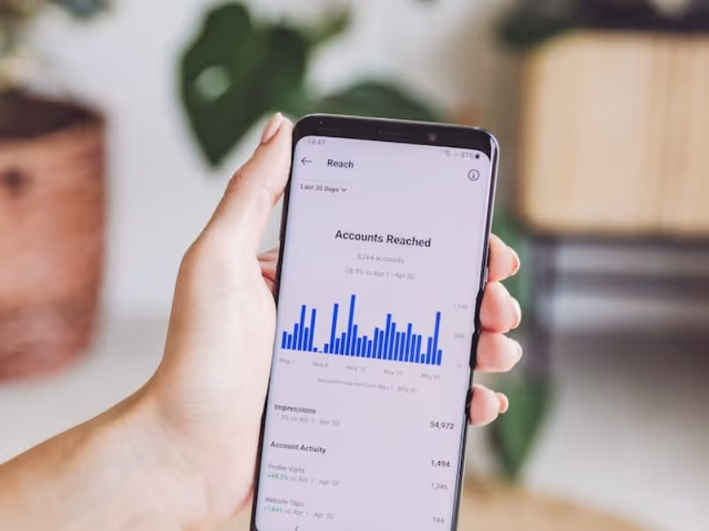 A phone showing social media stats