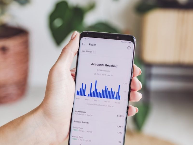 A phone showing social media stats