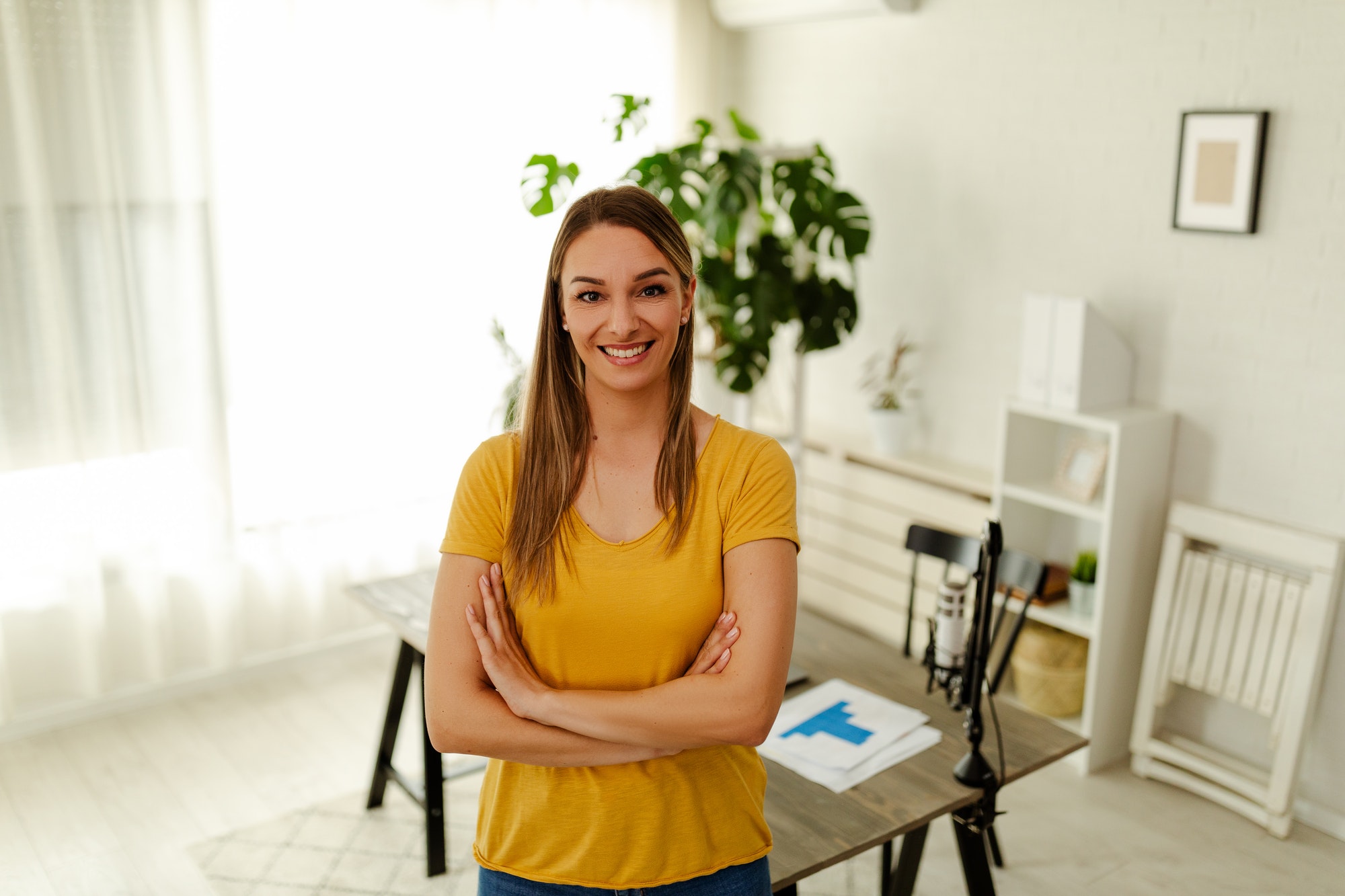 Portrait of a female online store business owner looking at camera and smiling.