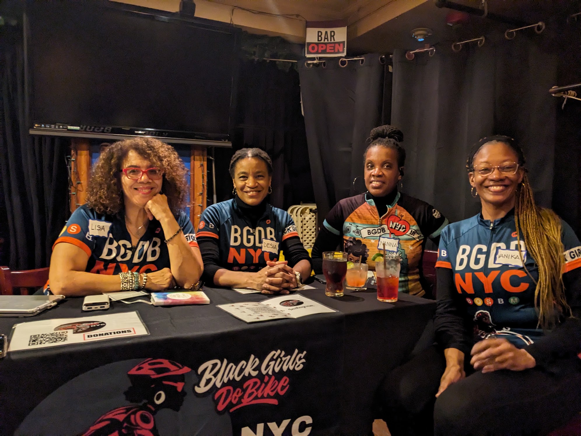 Black Girls Do Bike NYC members at a community event table