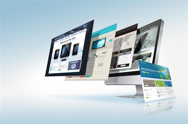 Computer screens displaying a polished Shopify store layout with a professional design to build trust.