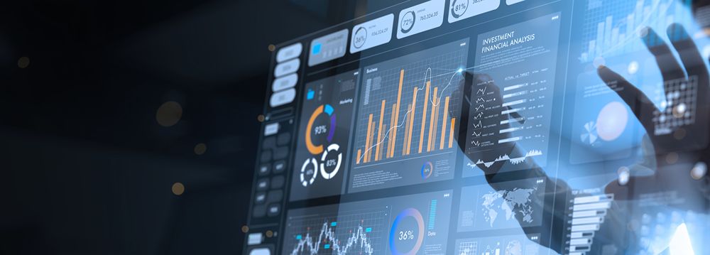 Analyst using a business analytics dashboard on a computer