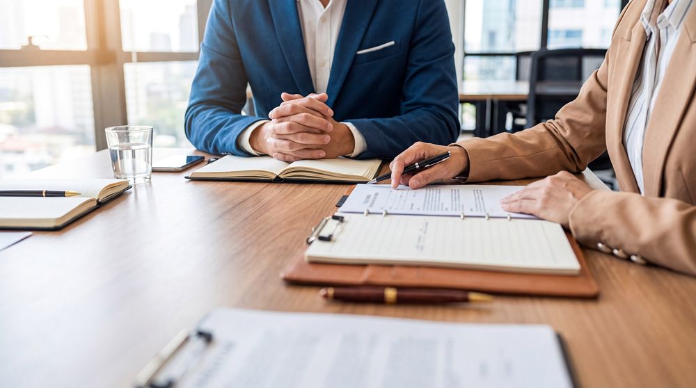 Business professionals reviewing documents in a modern office