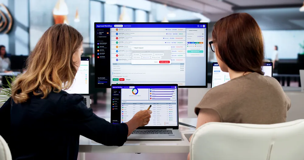 Woman in an office reviewing procurement expenses and approval tasks.
