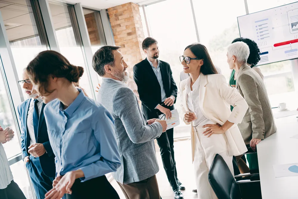 Group of diverse professionals networking at a business meeting