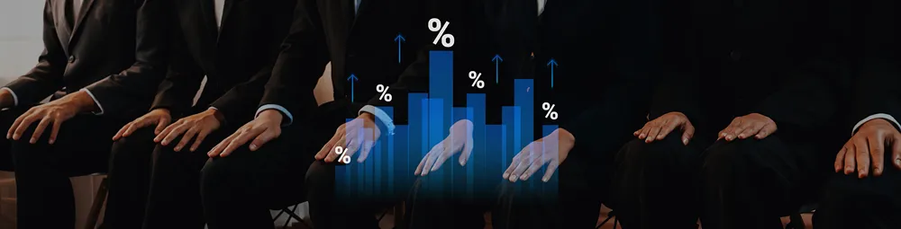 Professional team in suits reviewing growth statistics on a digital bar chart..