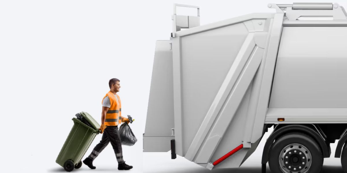 A refuse collector wearing a high-visibility orange vest pulls a green wheelie bin and carries a black rubbish bag towards the rear of a white waste collection lorry.
