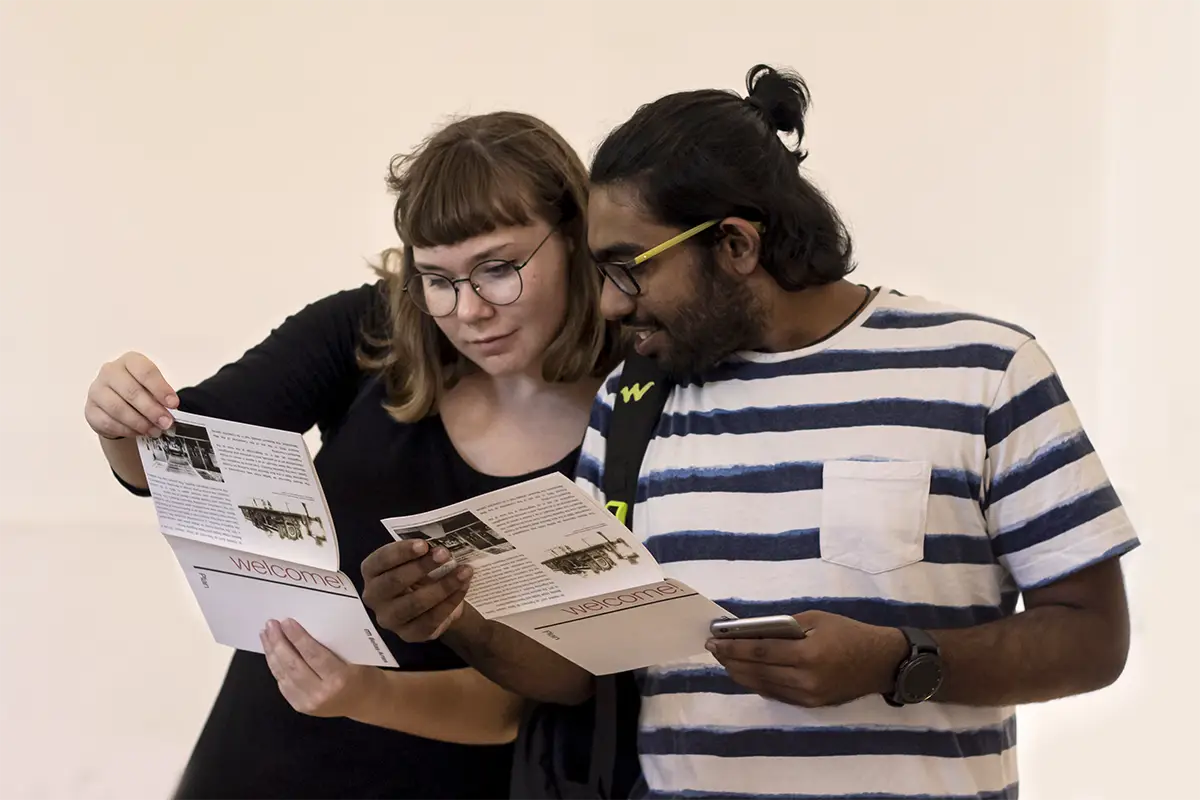 Minerva University students looking at guidance material for one of the Location Based Assignments organised by Staff and Faculty.