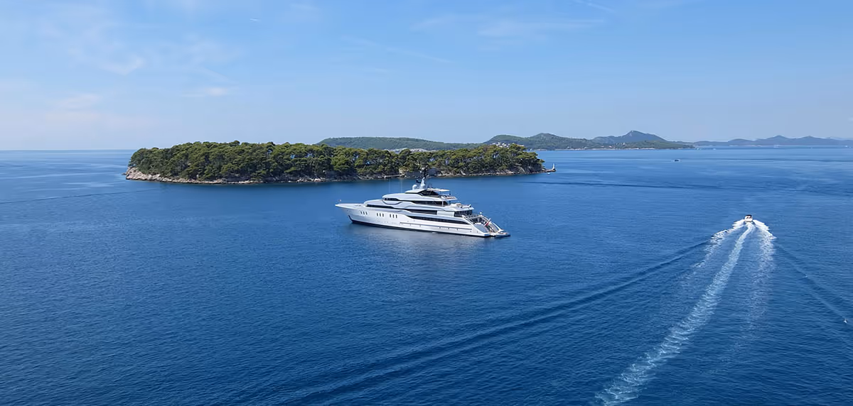 superyacht at anchor off a small island