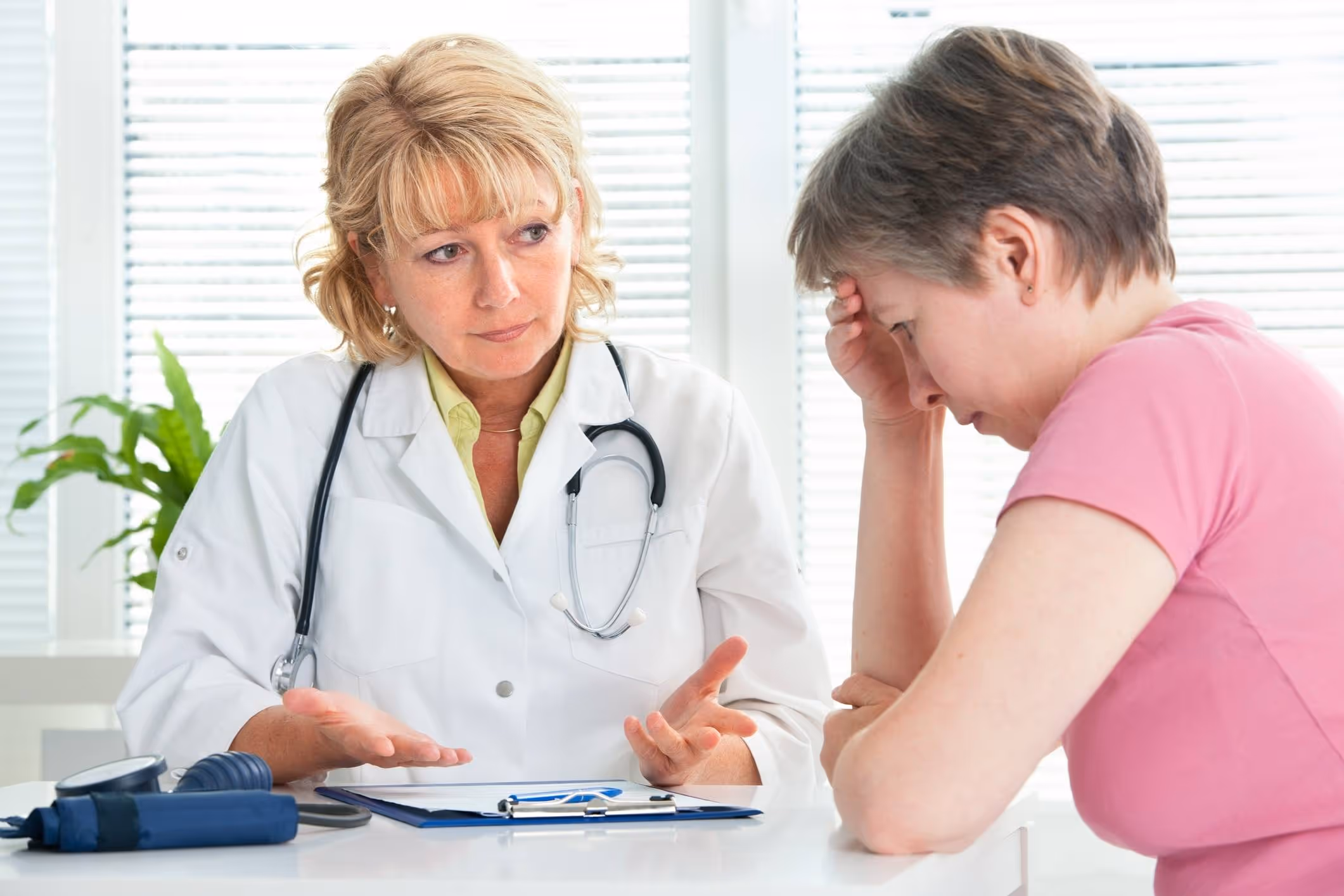 Doctor giving serious diagnosis, representing Escondido medical malpractice lawyer cases.