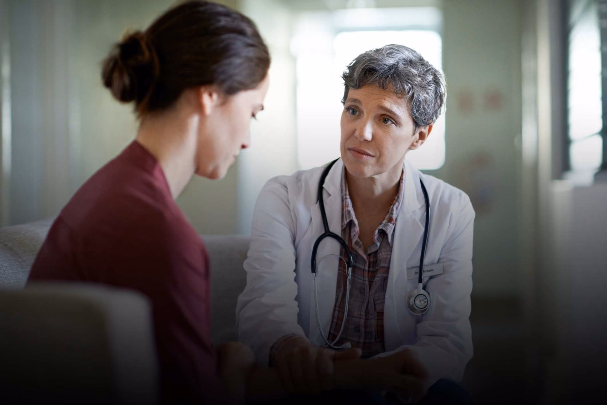A doctor encourages a new patient to contact a National City medical malpractice lawyer.