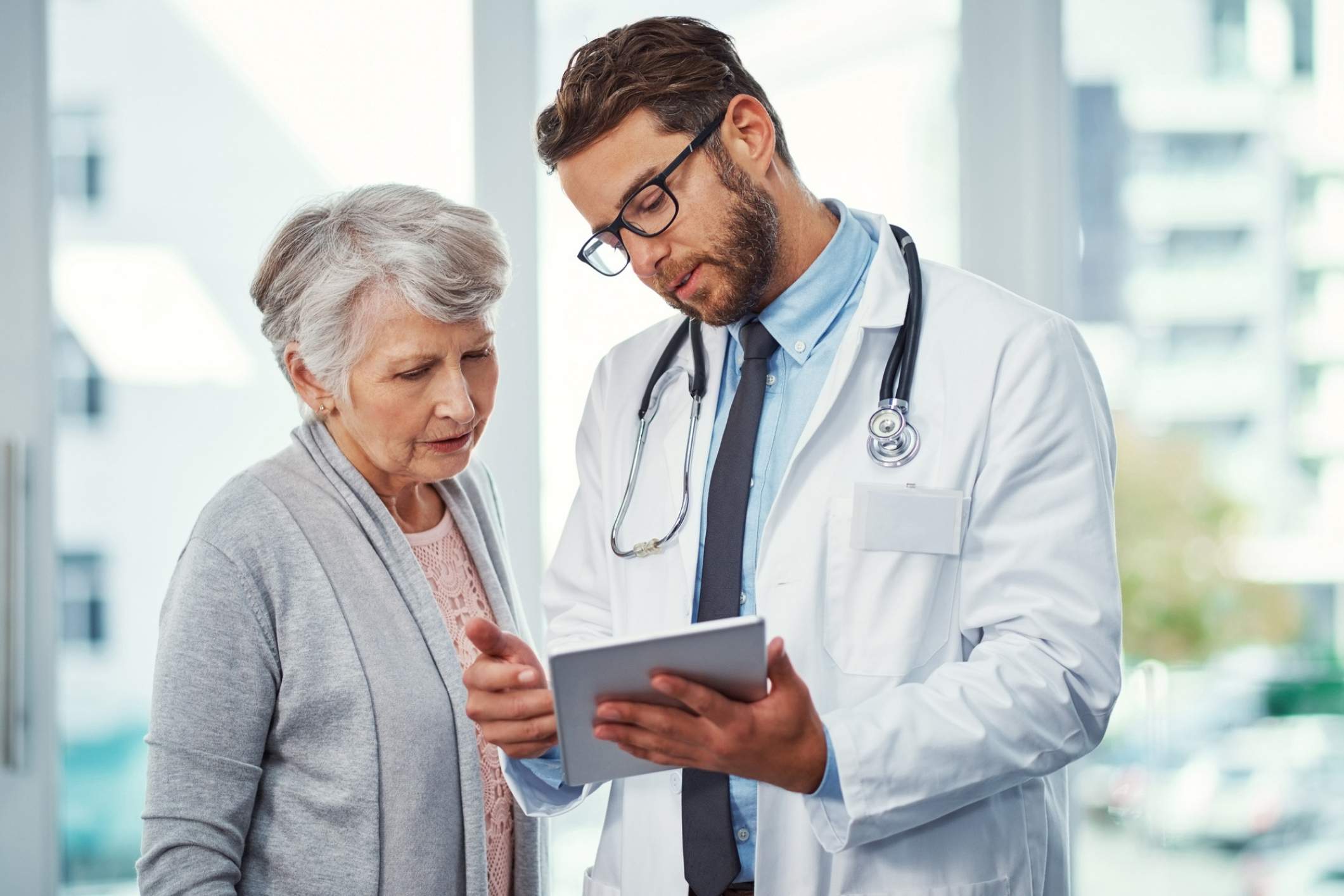 Doctor reviewing a treatment plan with a patient after an injury linked to Poway medical malpractice.
